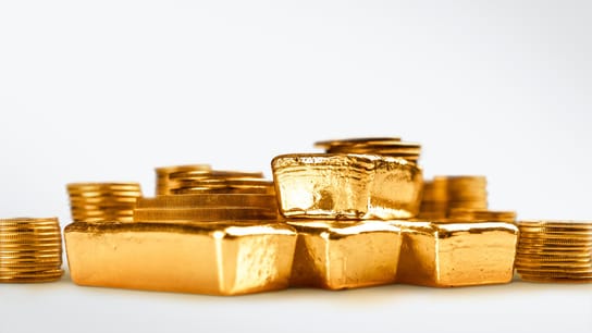 stacking gold bars, closeup view.